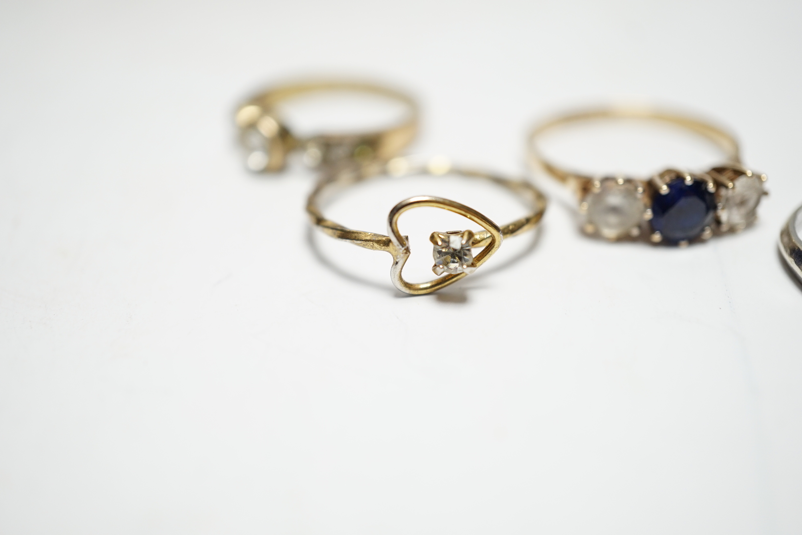Two 9ct and gem set rings, including diamond chip half eternity and two other rings.